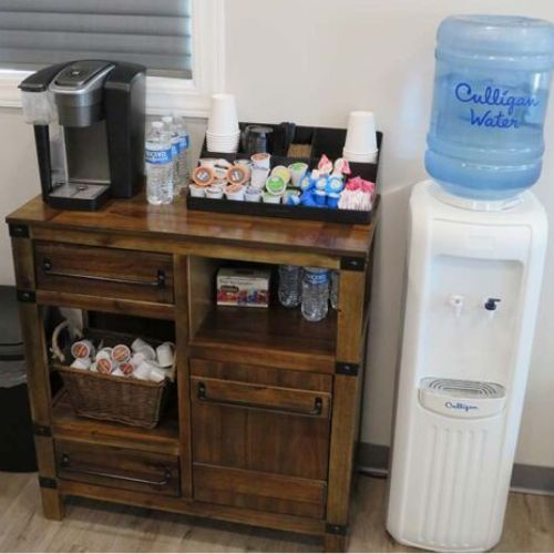 A coffee maker, water dispenser